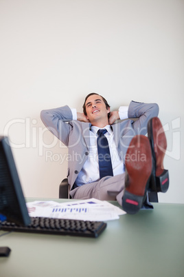 Businessman putting his feet up