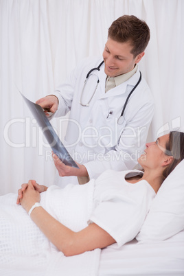 Doctor showing x-ray to his patient