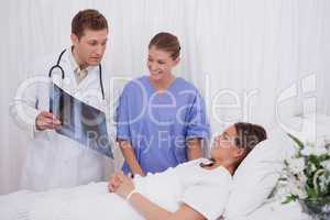 Doctors explaining x-ray to patient