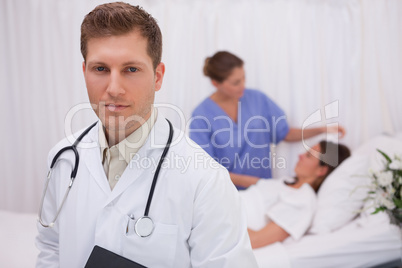 Doctor standing in his patients room