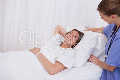 Surgeon plumping up pillow
