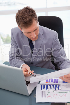 Businessman looking at statistics