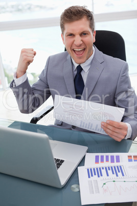 Businessman celebrating market research results