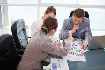 Business team discussing over market research