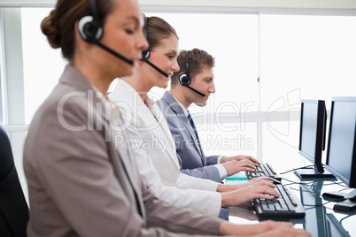 Side view of customer service assistants