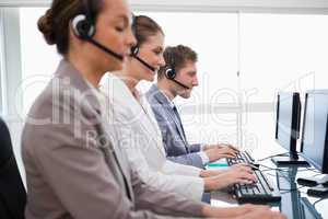 Side view of customer service assistants