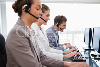 Side view of customer service employees