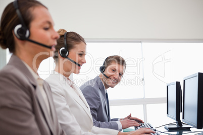 Side view of call center team