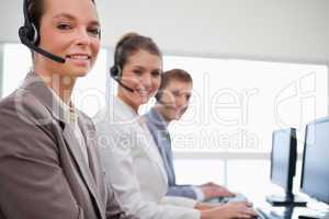 Side view of customer service team