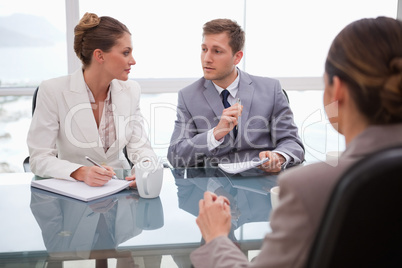 Business team deliberating with lawyer