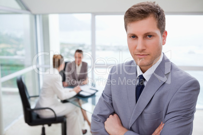 Young sales manager standing