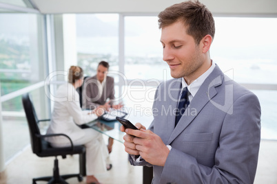 Sales manager writing text message