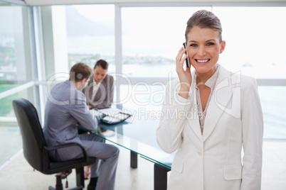 Smiling marketing manager on the phone