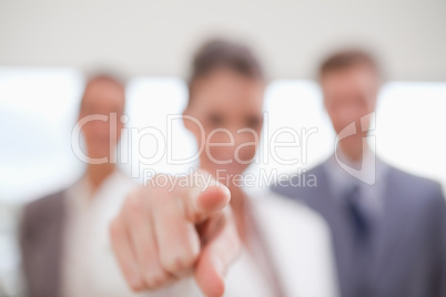 Personnel department team pointing at new employee