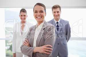 Smiling business consultant with arms folded