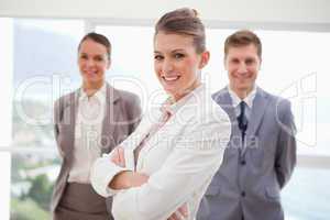 Market manager standing with arms folded