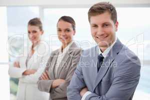 Business team standing with arms folded