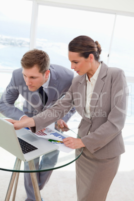 Analyst explaining report to her boss