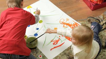 Children paint on canvas