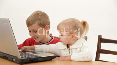 Children play on the computer