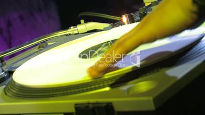DJ spinning the vinyl in the club