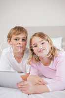 Portrait of children using a tablet computer