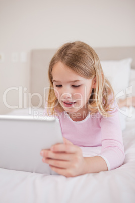 Portrait of a little girl using a tablet computer