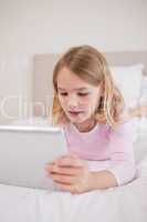 Portrait of a little girl using a tablet computer