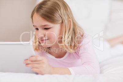 Cute girl using a tablet computer