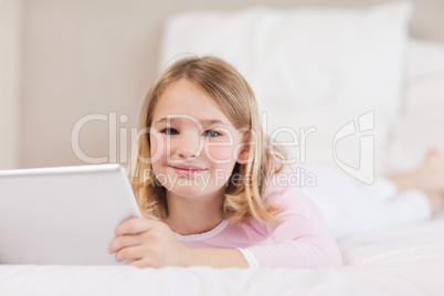 Cute little girl using a tablet computer