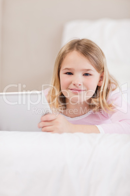 Portrait of a cute little girl using a tablet computer