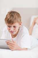 Portrait of a young boy using a tablet computer