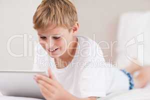 Smiling boy using a tablet computer