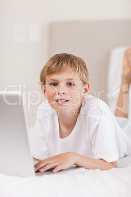 Portrait of a boy using a laptop