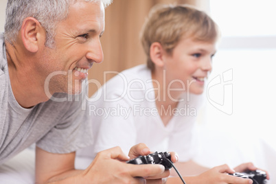 Father and his son playing video games