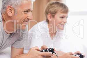 Father and his son playing video games