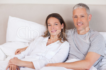 Couple lying on a bed