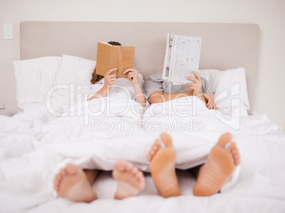 Playful couple reading