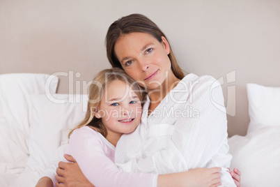 Mother and daughter hugging