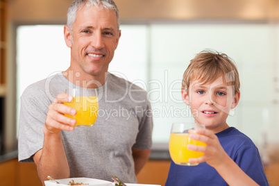 Boy and his father having breakfast