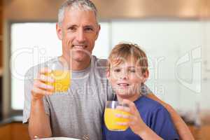 Young boy and his father having breakfast