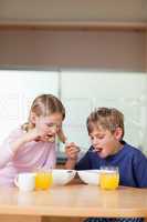 Portrait of children having breakfast