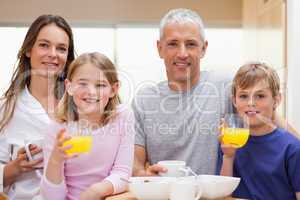 Happy family having breakfast