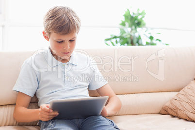 Cute boy using tablet computer