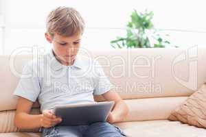 Cute boy using tablet computer