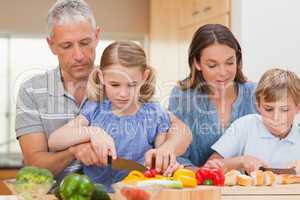 Charming family cooking together