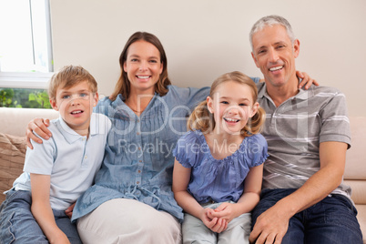 Family sitting on a sofa