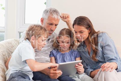 Family using a tablet computer
