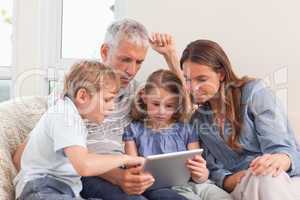 Family using a tablet computer
