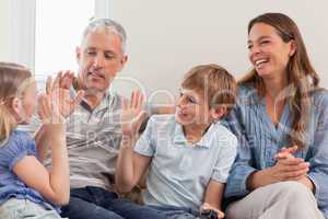 Cheerful family playing video games